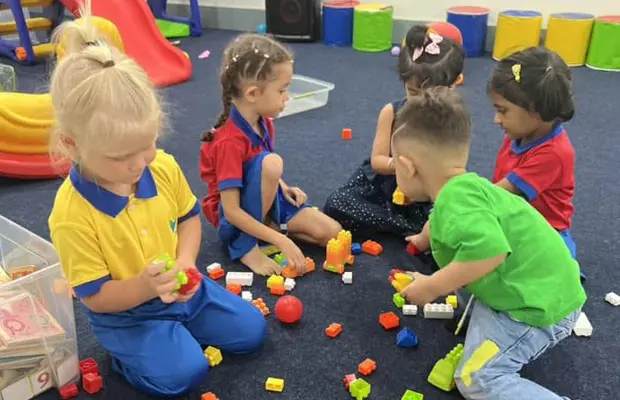 Children enjoying creative classroom activities often valued by families researching preschools in Dubai