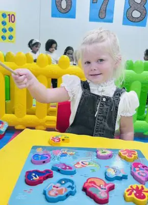 Children participating in hands-on learning activities that support confidence and development