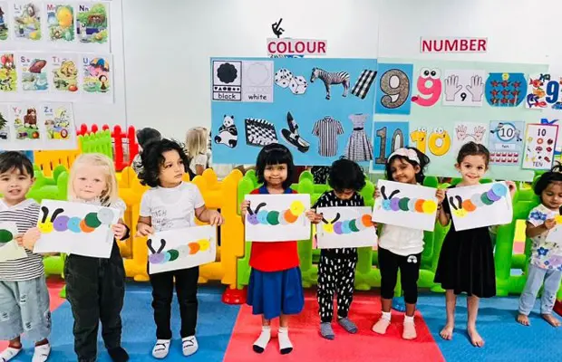Children enjoying creative classroom activities often valued by families researching preschools in Dubai