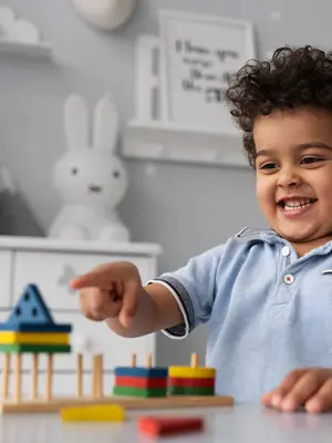 Child exploring educational toys and activities that support early childhood development