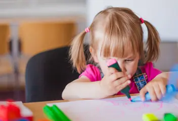 Children participating in creative arts and design activities at a child development program in Dubai
