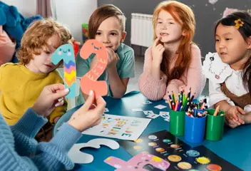 Children developing social and emotional skills through group learning activities in Dubai